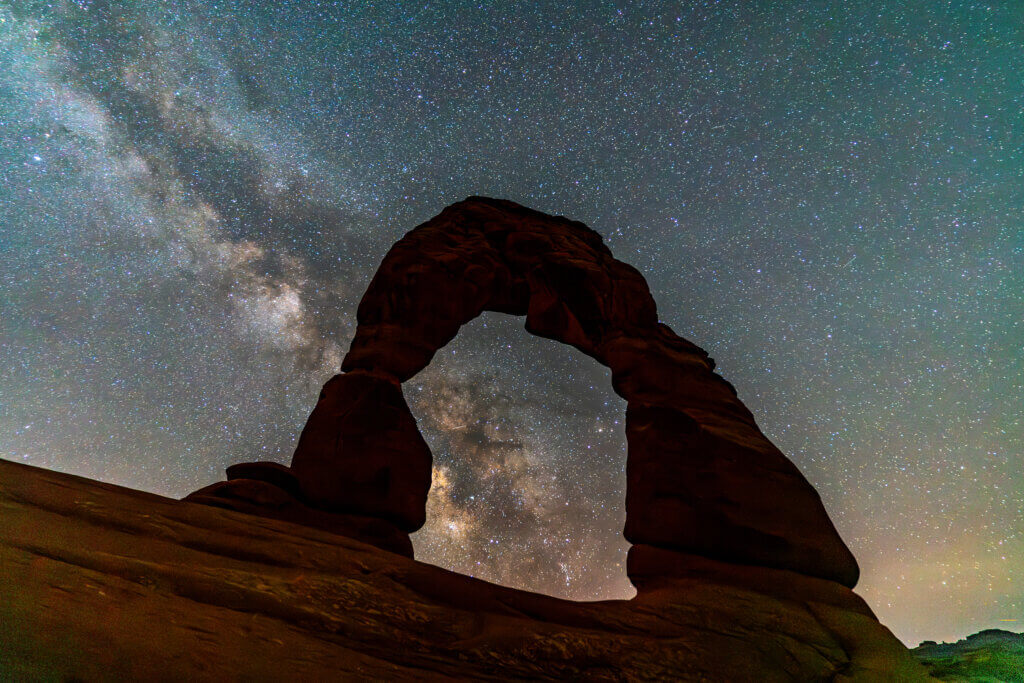 The Milky Way ascending through Delicate Arch in Arches National Park