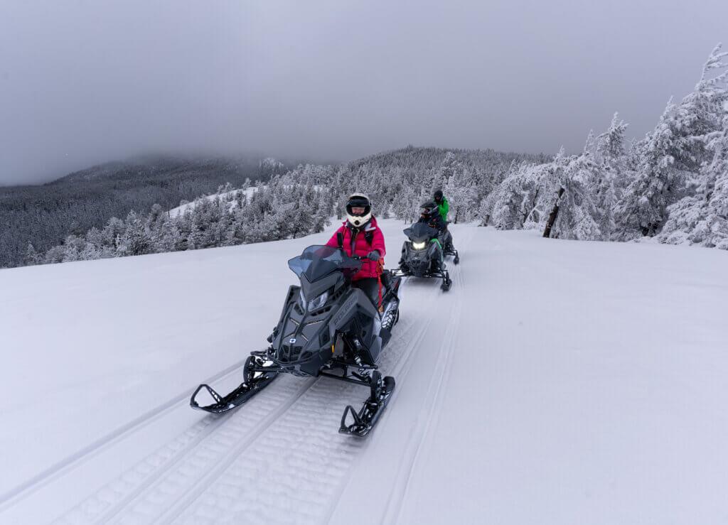 snowmobiling in bend in winter